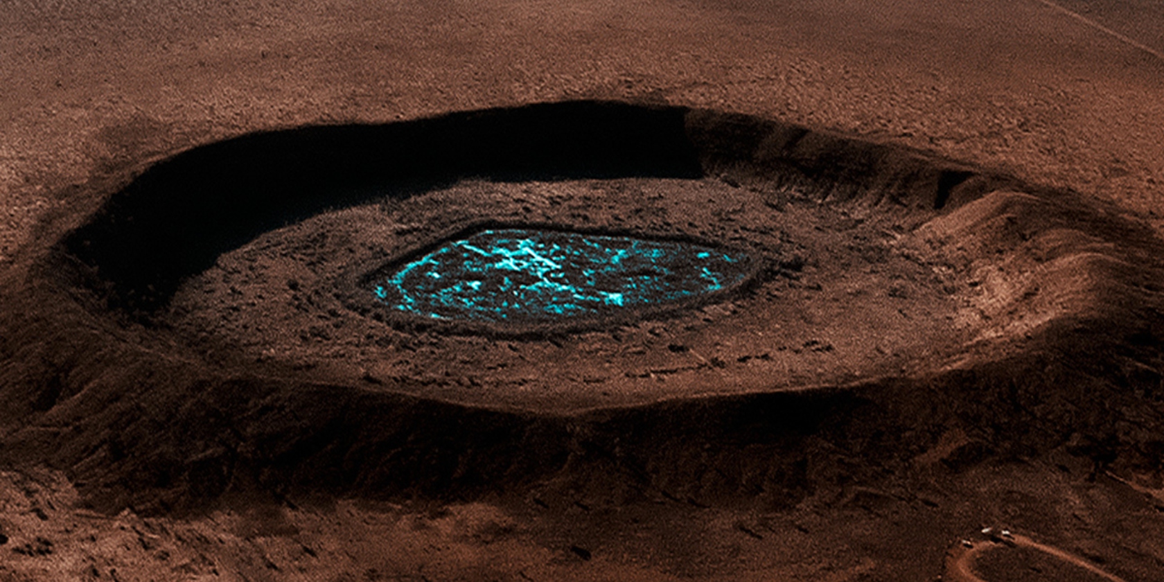 An image for the Apple TV documentary Fireball: Visitors from Darker Worlds depicting a pit with a glowing blue center An image for the Apple TV documentary Fireball: Visitors from Darker Worlds depicting a pit with a glowing blue center