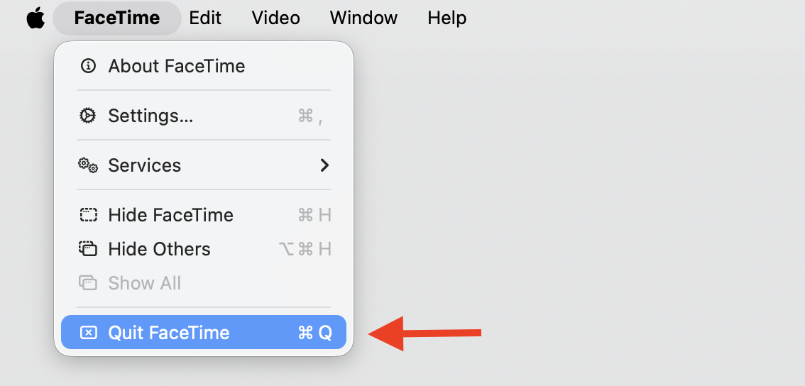 macOS menu bar on an Apple laptop with the app menu open and the Quit option highlighted to close apps that keep using the camera.