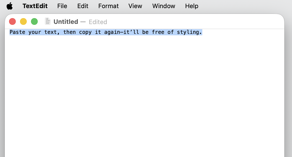 A TextEdit plain-text document on macOS showing pasted unformatted text highlighted and ready to copy again free of styling on a MacBook.