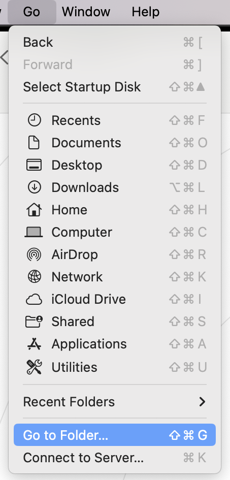 The Go menu in Finder on a Mac, with Go to Folder selected. Step one of instructions on how to delete application cache on Mac manually, using Finder.