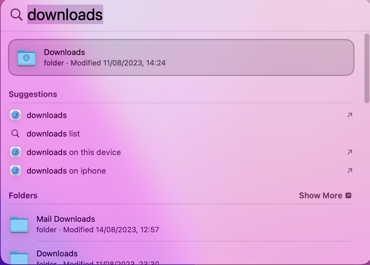 To open Spotlight search, begin by clicking on the magnifying glass icon in the top-right corner of your computer screen. In the search type in Downloads to find your folder, or if you’re looking for a specific item you've downloaded, type that instead.