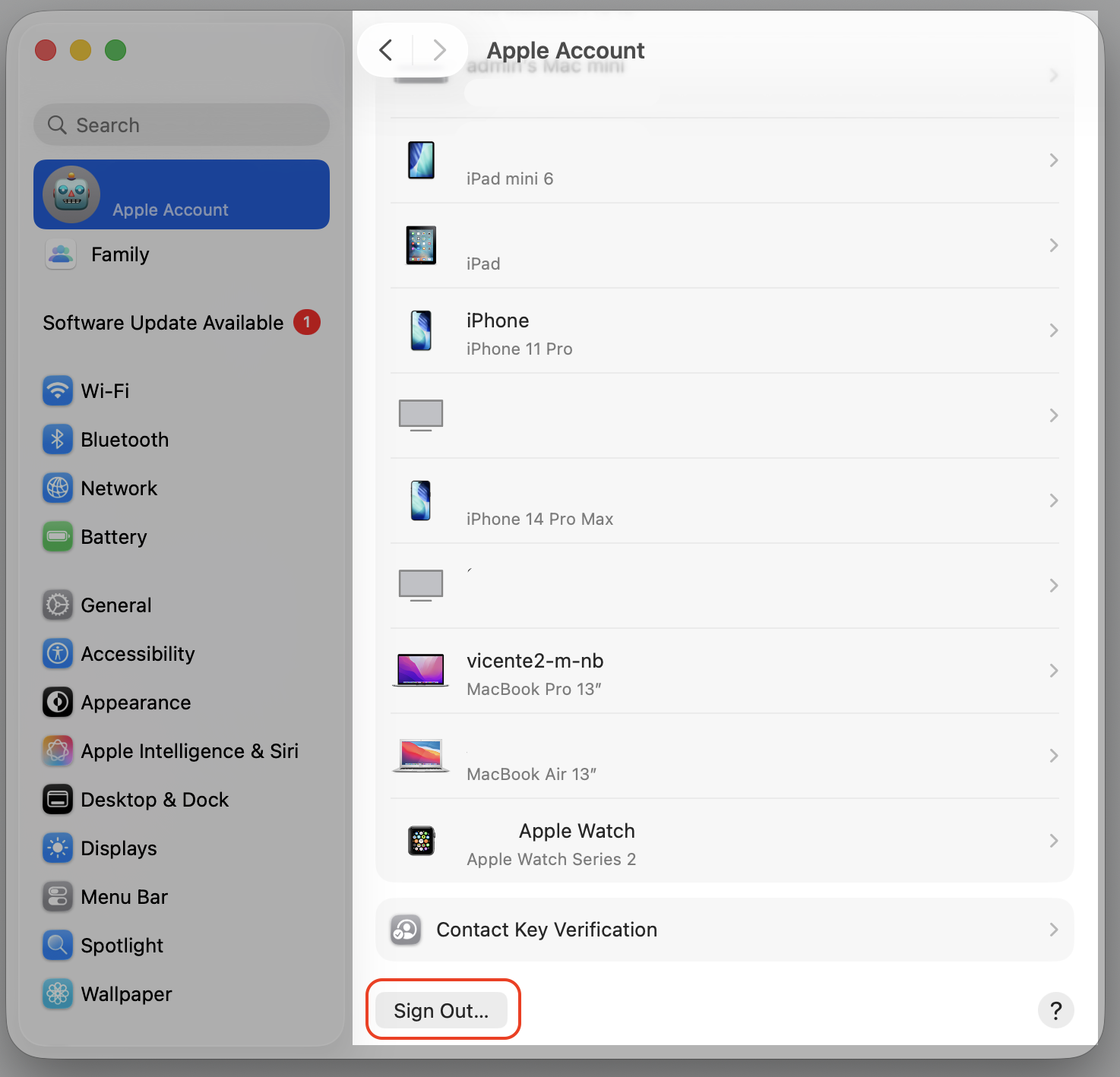 macOS System Settings Apple Account page on a MacBook scrolled down to reveal the Sign Out button used to refresh Apple ID services.