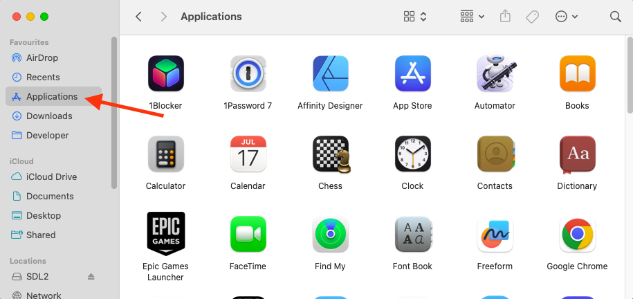 A list of system folders inside Finder on Mac. Select Applications to find and delete malicious apps from your Mac.