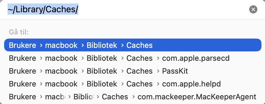 Skriv inn ~/Library/Caches, og trykk deretter Enter. Dette tar deg rett til brukerbufferfilene dine, som dekker flere apper på Macen din.