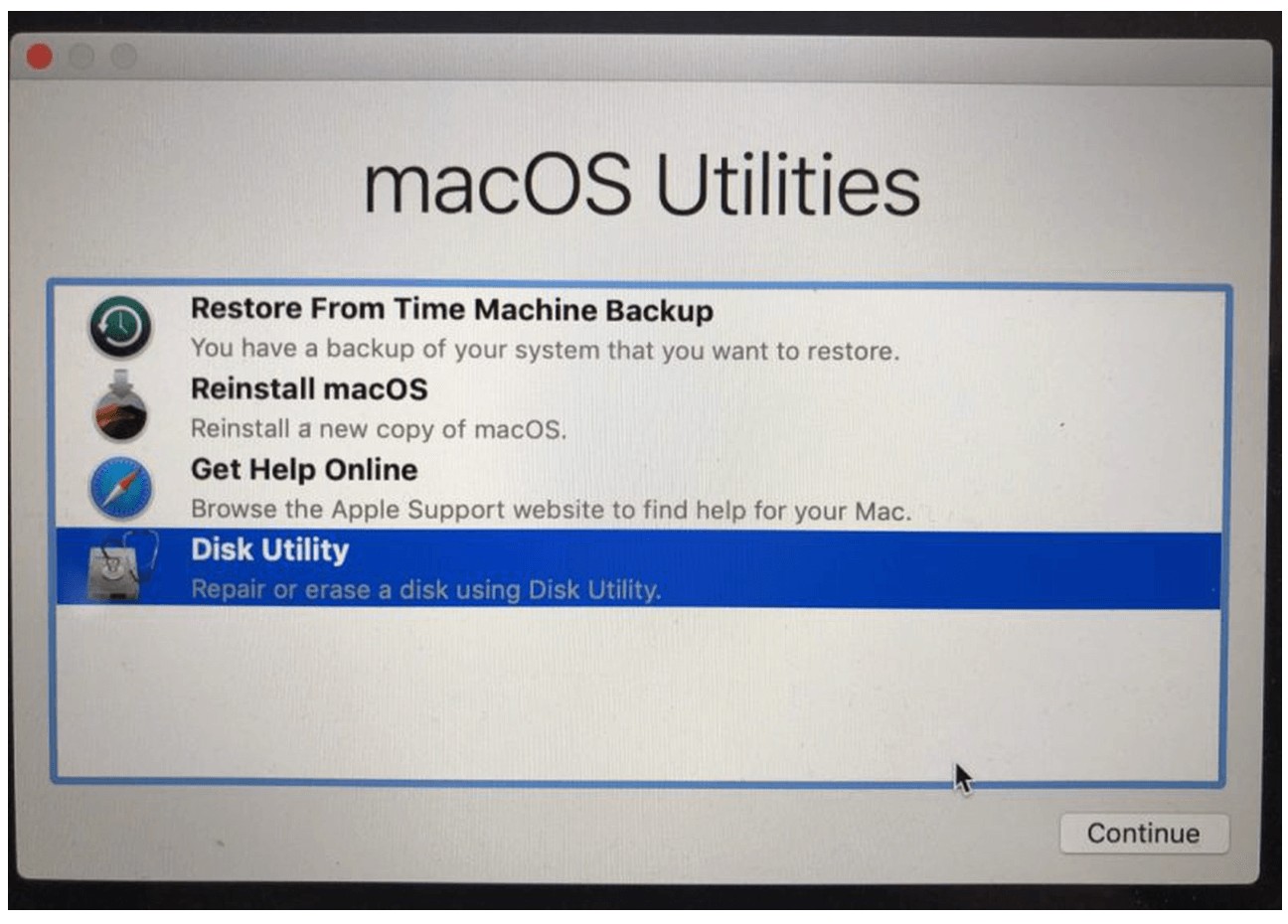 To start reinstalling macOS, you first need to power your Mac into recovery mode. You can do this by turning on the Mac and holding down Command + R until you see the Apple logo. You’ll know you’ve entered Recovery Mode when you see the macOS Utilities window. From there, you need to go to Disk Utility.