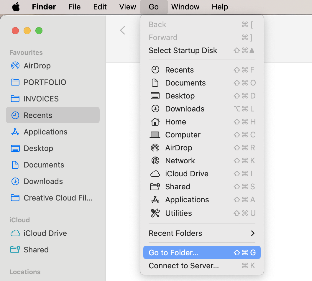 Finder on a Mac. The Go menu is open and Go to Folder is selected. How to manually delete cache on macOS Sonoma: get rid of system cache on Mac.