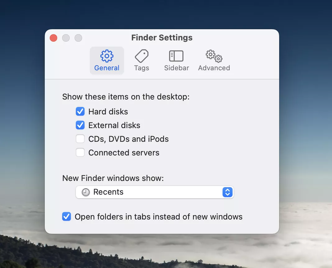 In the Finder Settings window, ensure you’re on the General tab and check if the tick box next to External disks is ticked.
