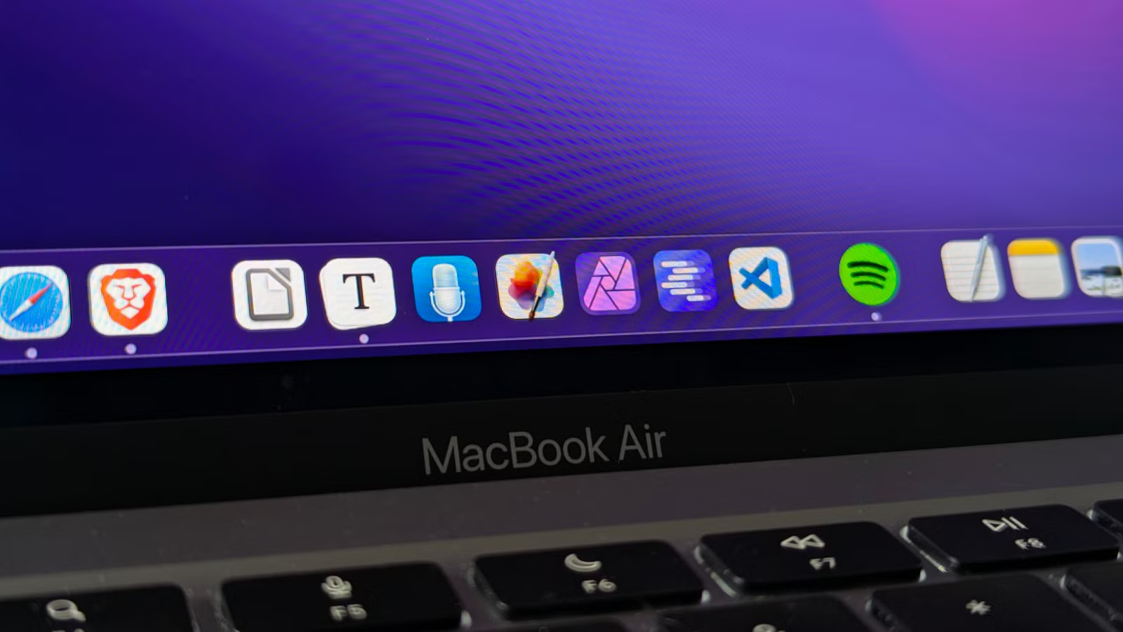 Move your cursor onto the secondary display, push it to the very bottom edge, and hold for a few seconds until the Dock appears on that screen.