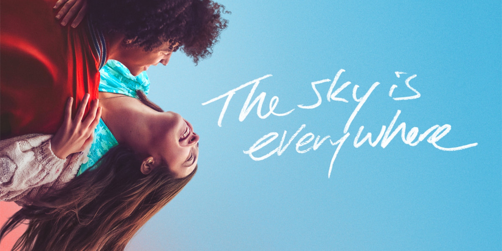 An image of a man and woman happily embracing against clear blue skies in the image for The Sky is Everywhere An image of a man and woman happily embracing against clear blue skies in the image for The Sky is Everywhere