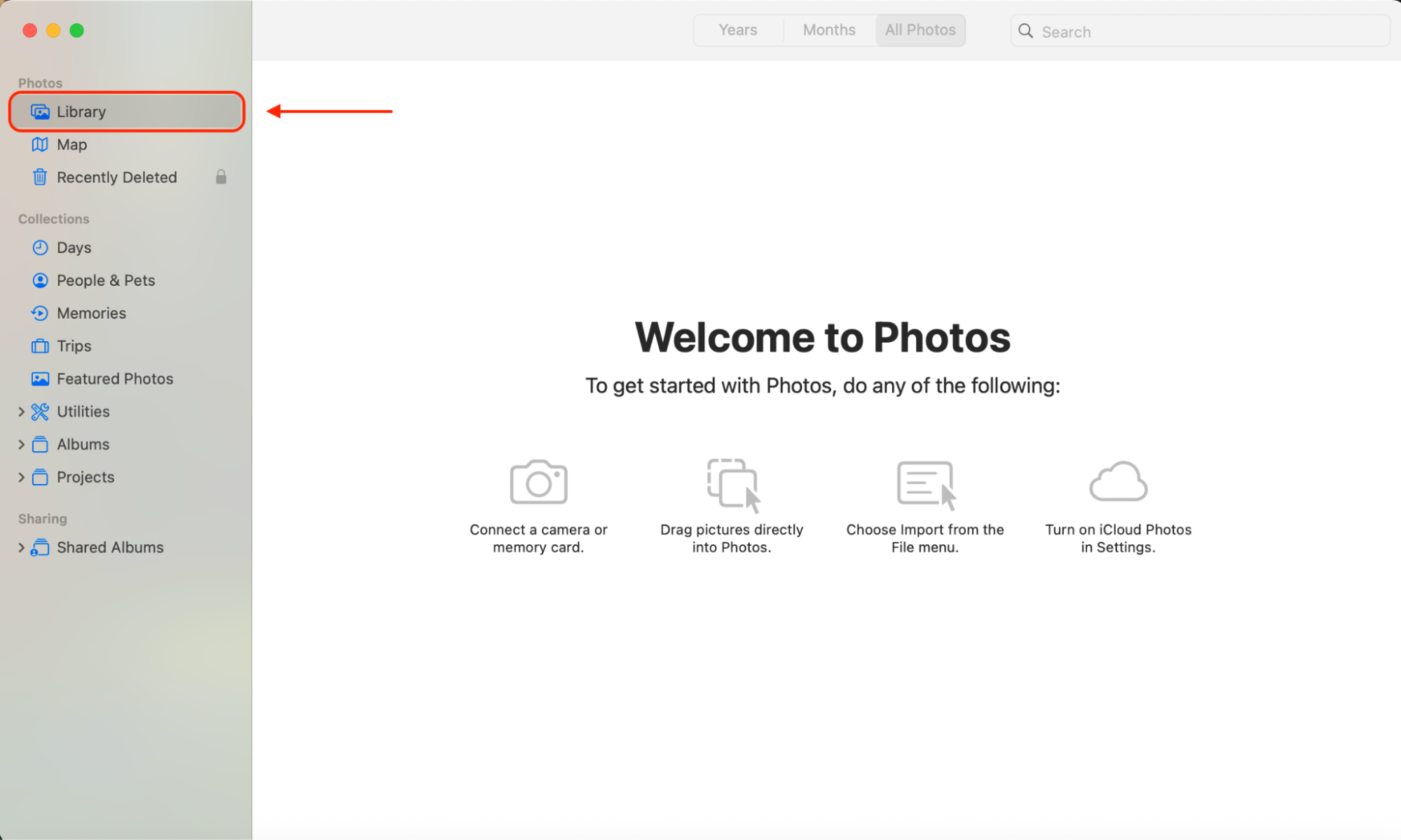 Open the Photos app on your Mac, then choose Library from the sidebar to view your full collection and start selecting images.