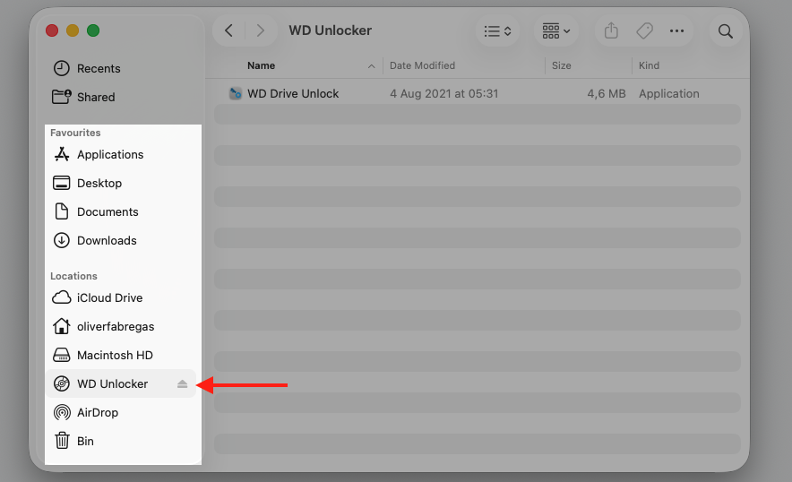 Finder window on a Ventura MacBook with an external WD Unlocker drive in the sidebar, shown before disconnecting Mac accessories.