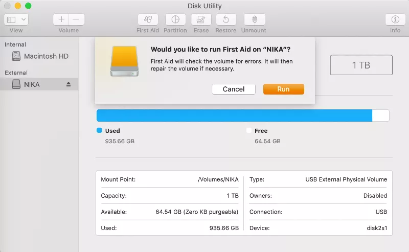 disk utility window open on external hard drive displaying a prompt to run First Aid on the disk