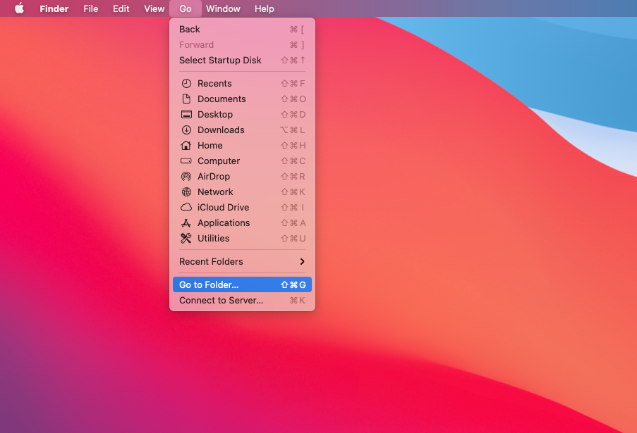 The Go menu in Finder on Mac. Select the Go to Folder option to access Library files where you can remove software leftovers on Mac.