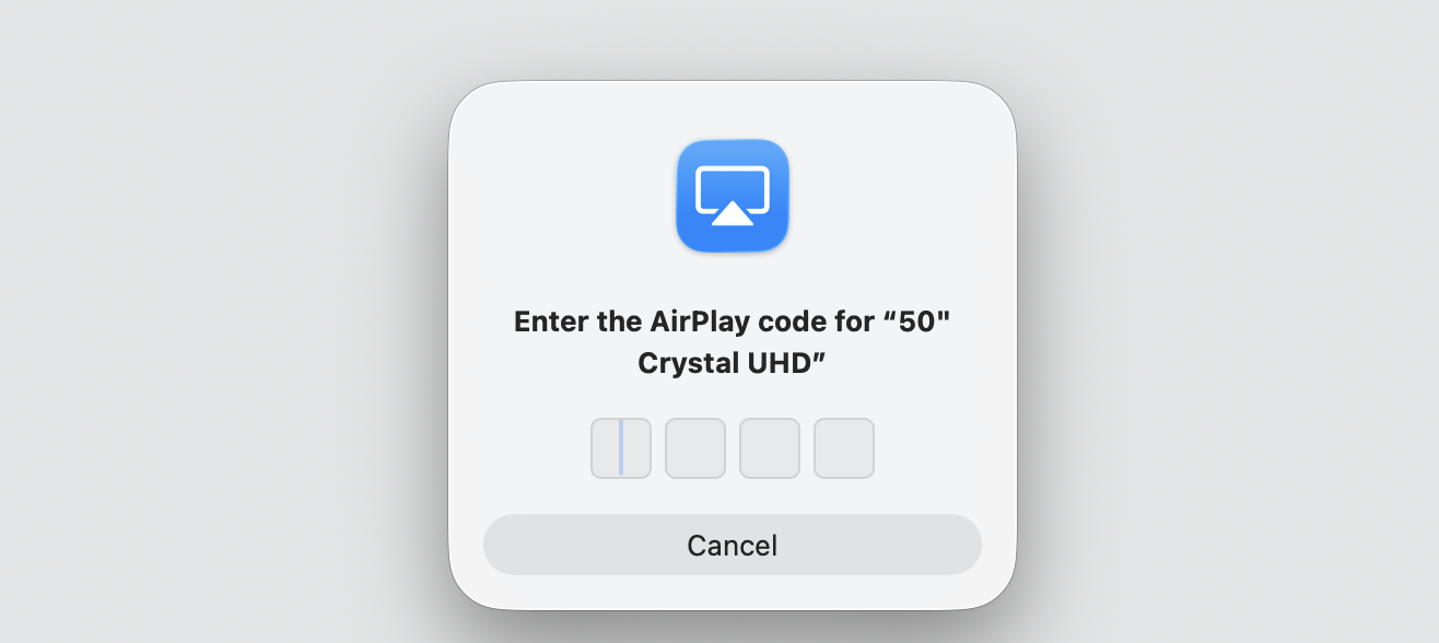 AirPlay code prompt on a MacBook asking you to enter the four-digit passcode shown on the 50-inch Crystal UHD Roku TV to finish mirroring