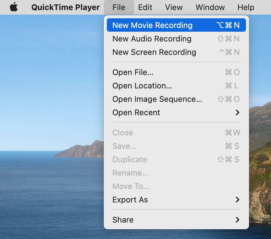 QuickTime Player is opened on a MacBook. Select File, followed by New Movie Recording in the menu bar to open the camera on your Mac laptop.