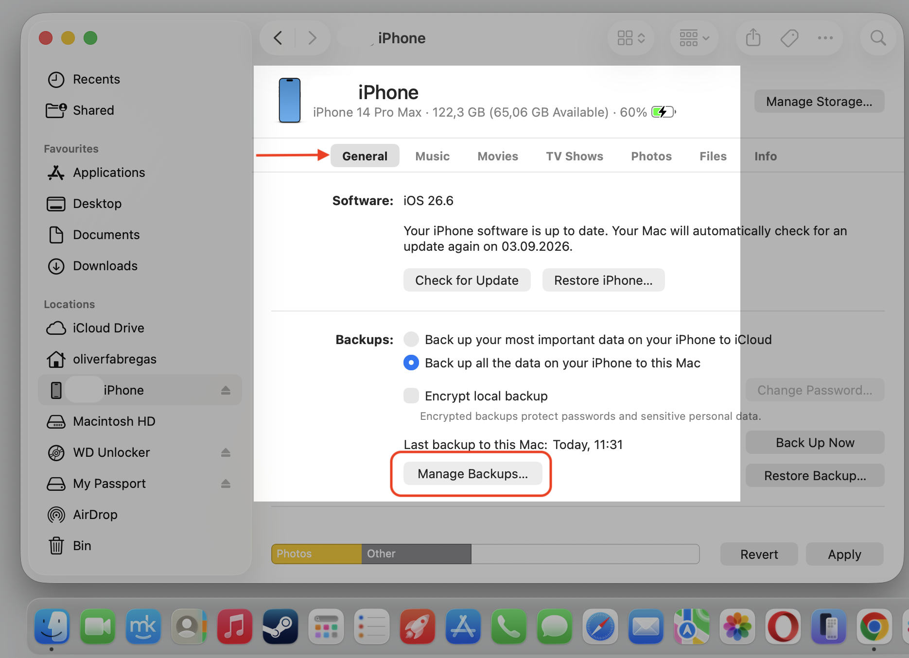 Finder iPhone General tab on a MacBook with Manage Backups highlighted to review synced device data taking up Apple Music storage on Mac.