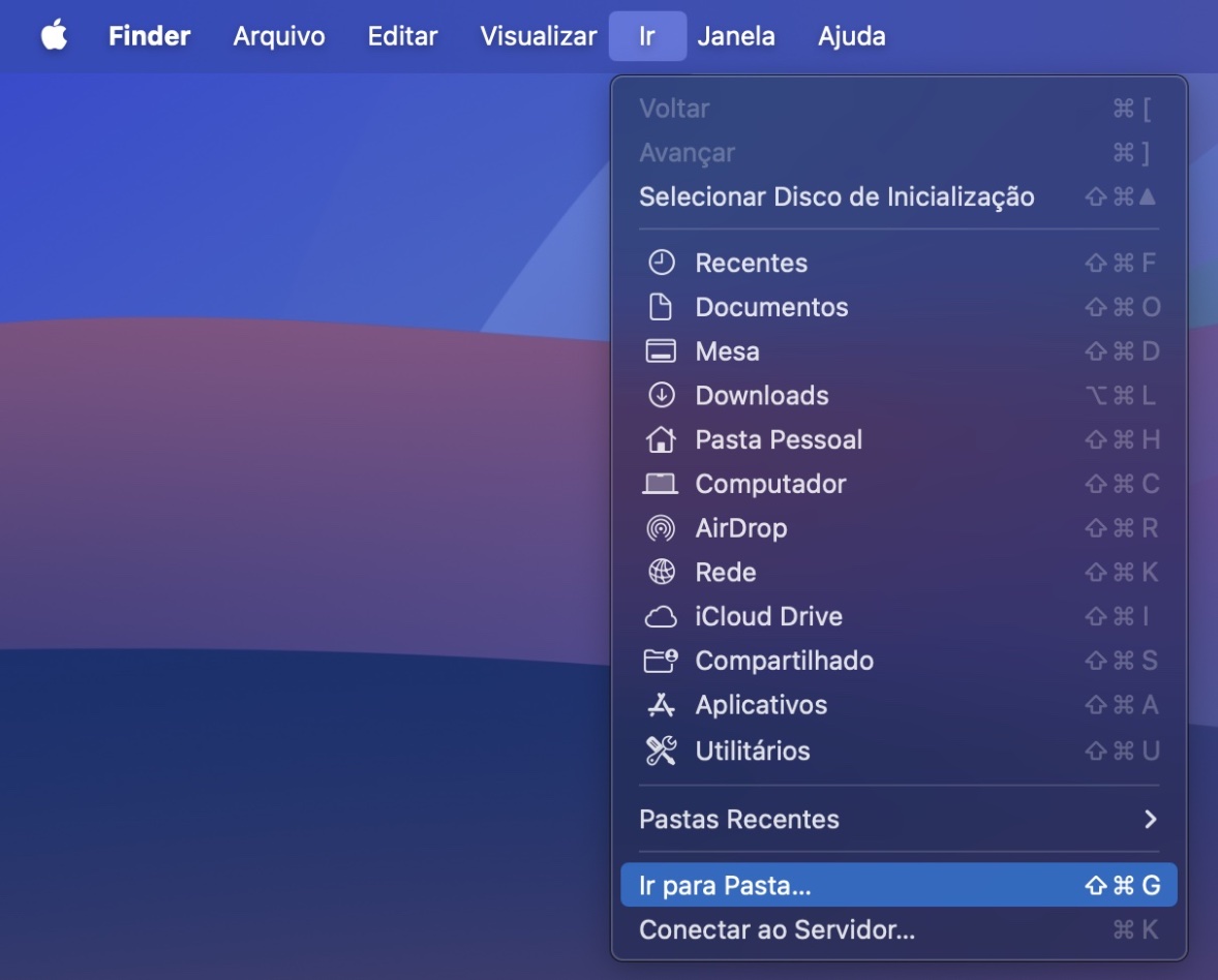 Parte de uma janela do Finder no Mac. O menu Ir está aberto e Ir para Pasta está destacado. Primeiro passo do guia para limpar o cache do Mail no Mac manualmente.
