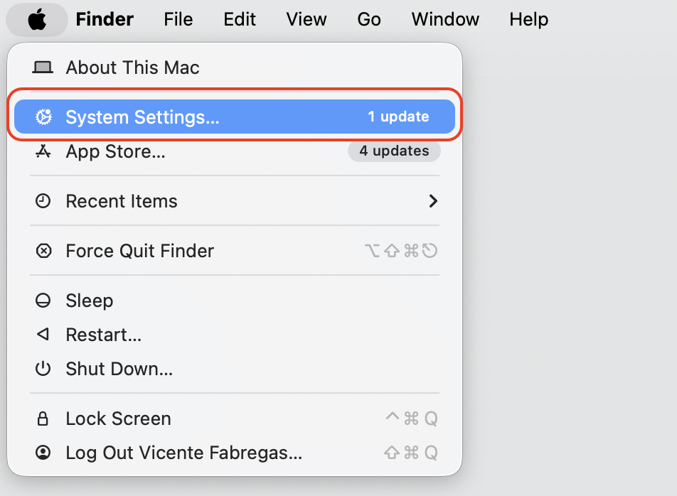 Apple menu opened in the top-left corner of macOS on a MacBook with System Settings selected to manage Apple ID and account options.