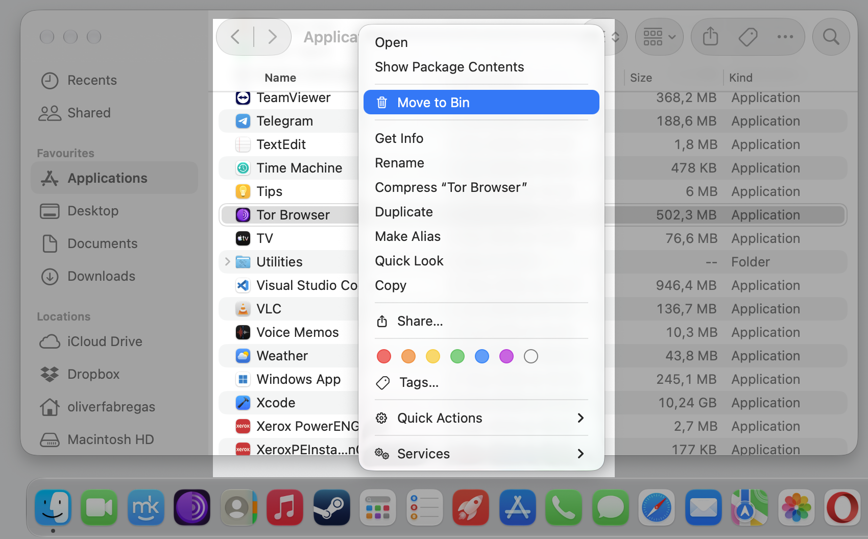 Finder right-click menu on an iMac showing Move to Bin highlighted for Tor Browser in the Applications folder to delete the Tor Browser app. Finder right-click menu on an iMac showing Move to Bin highlighted for Tor Browser in the Applications folder to delete the Tor Browser app.