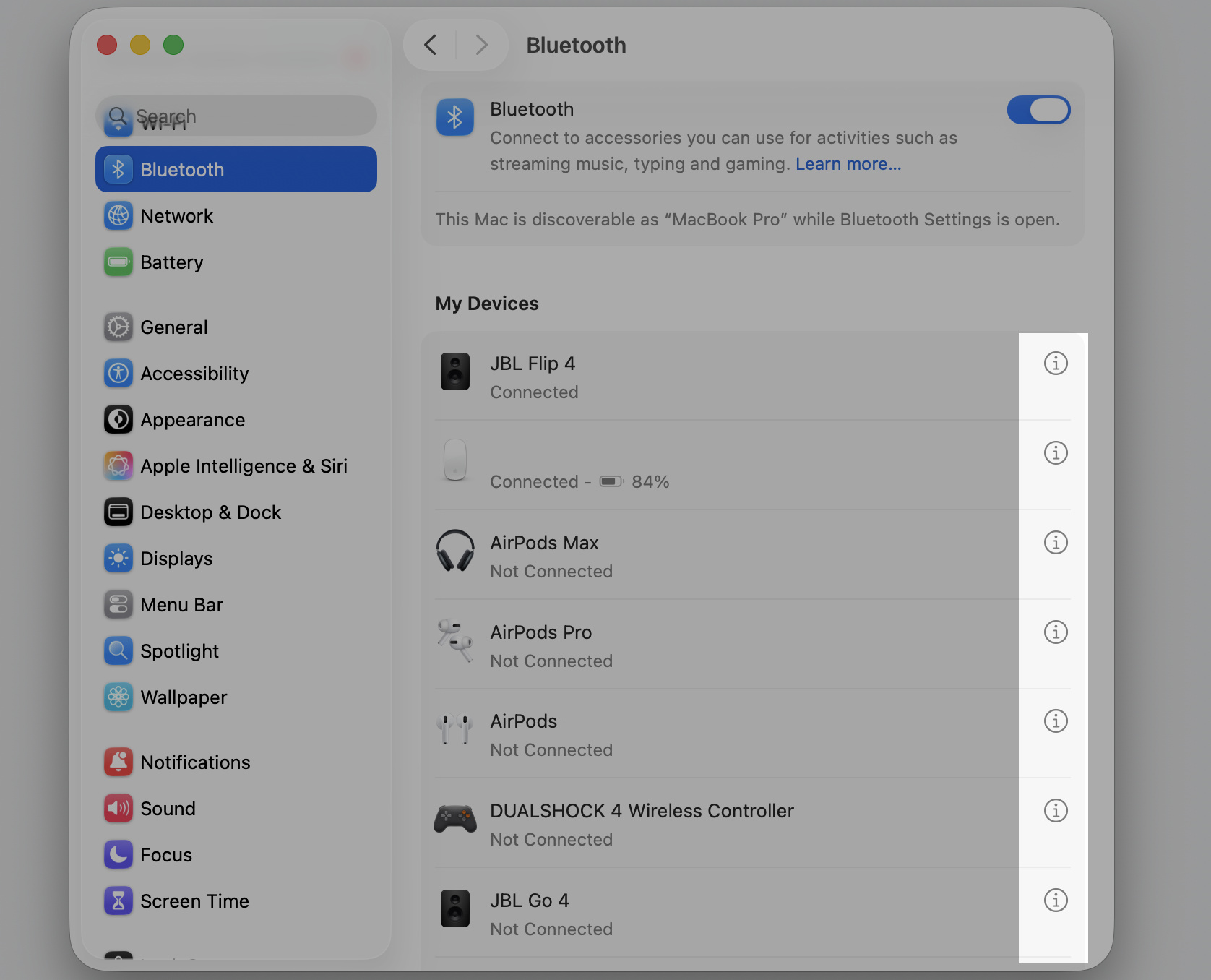 Bluetooth device settings in macOS on an Apple laptop, clicking the Info (i) button beside a device to fix bluetoothd CPU usage.