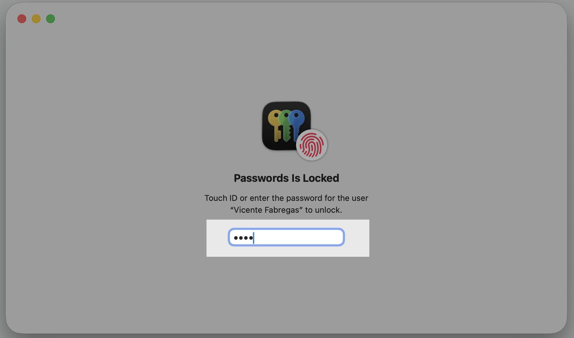 The Passwords app unlock screen on an Apple laptop asking for Touch ID or the Mac login password before showing the FileVault Recovery Key.