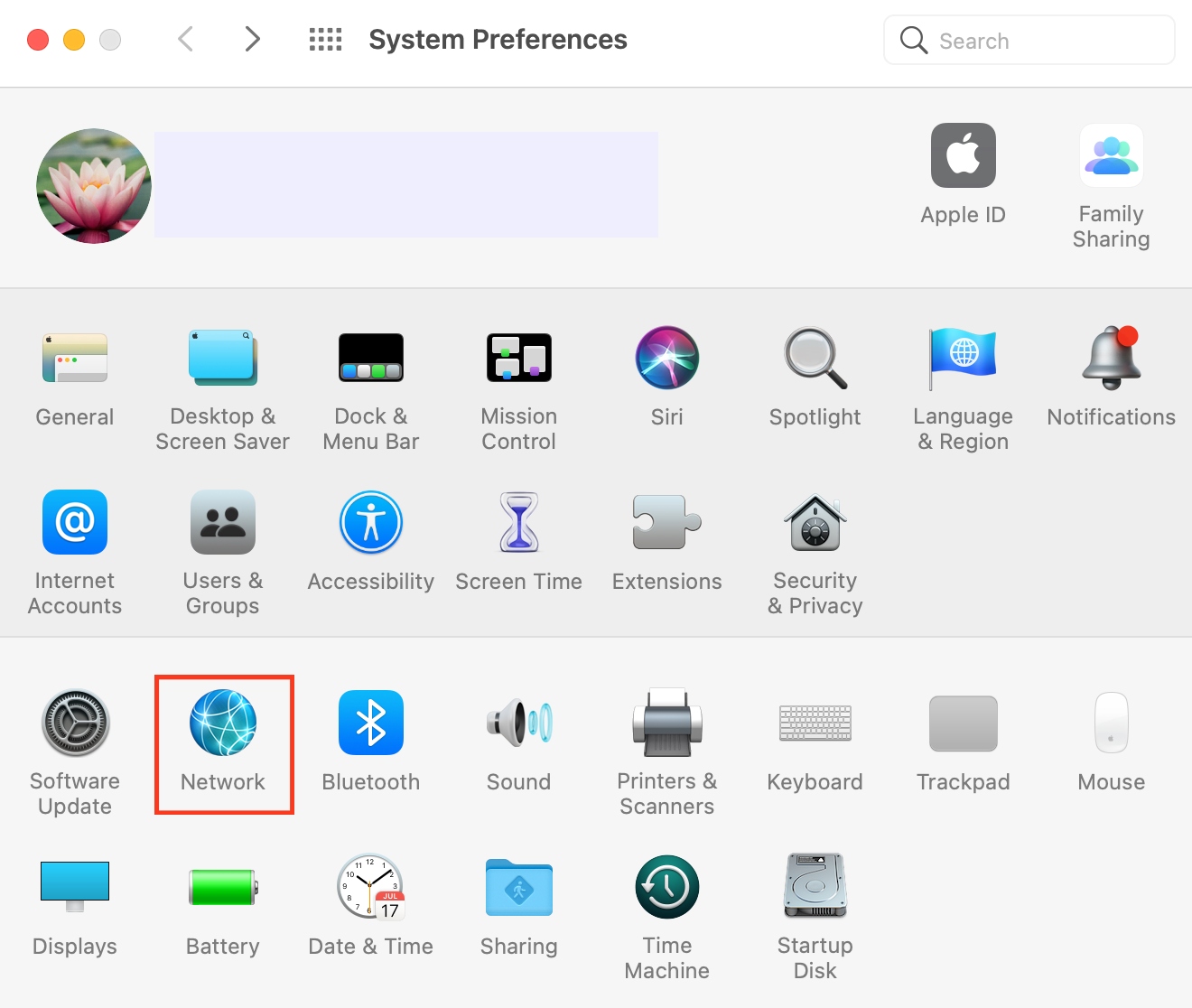 System Preferences is opened on a MacBook device. Select Network to use a manual DNS server and fix the clock error on your Mac. System Preferences is opened on a MacBook device. Select Network to use a manual DNS server and fix the clock error on your Mac.
