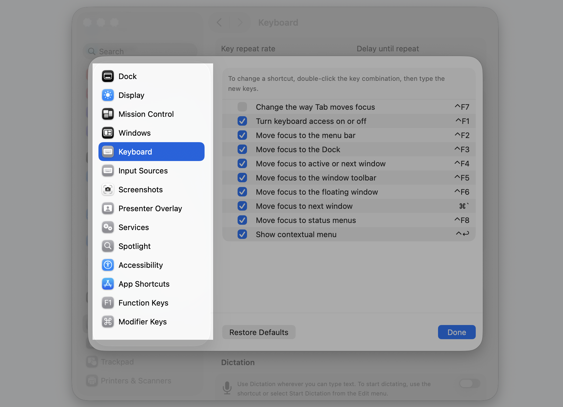 The Keyboard pane in macOS System Settings on a MacBook, where you click Keyboard Shortcuts to review hotkeys that stopped working.