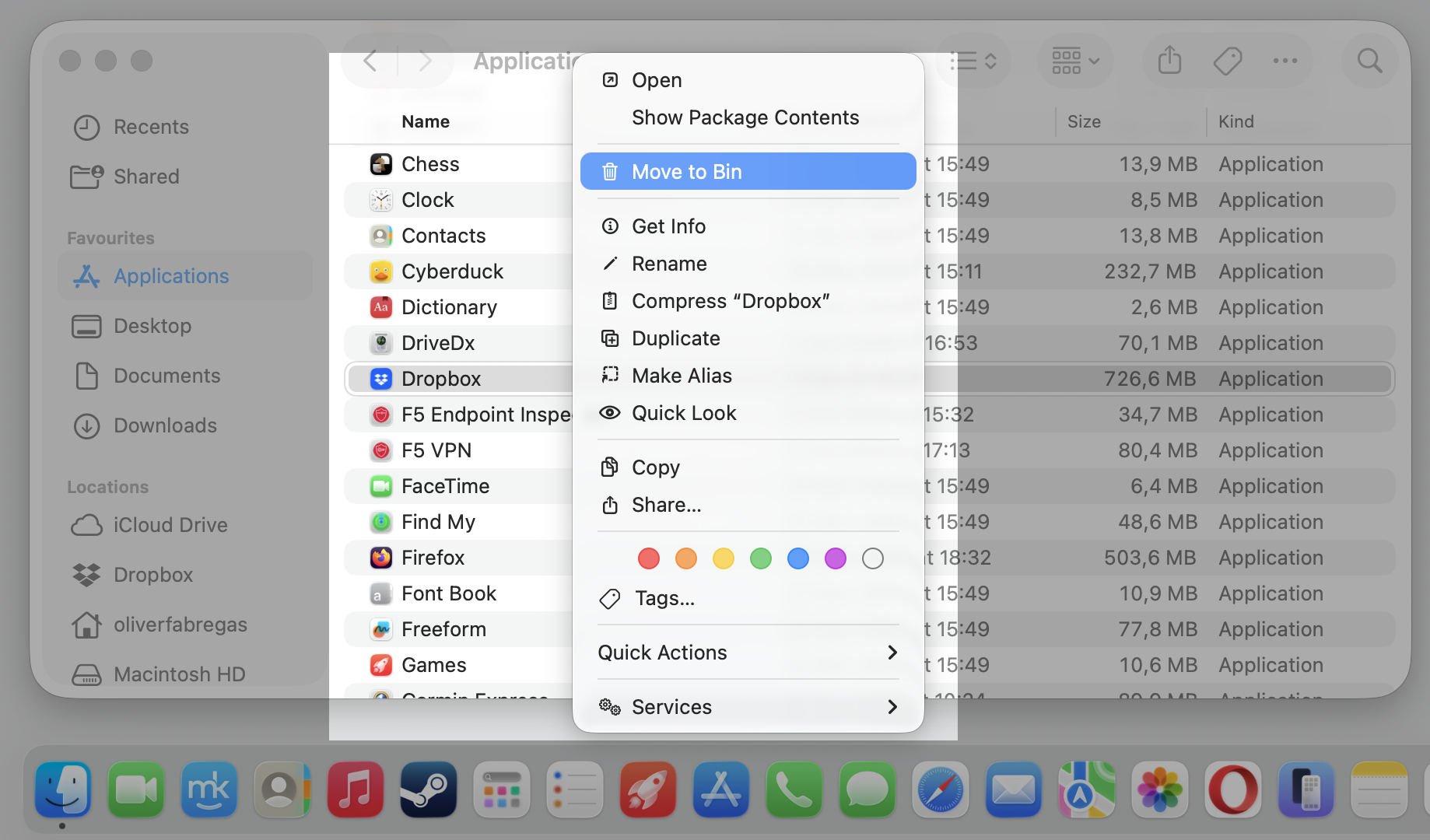 Finder Applications window on macOS with the Dropbox right-click menu open and Move to Bin selected to fully uninstall the app.