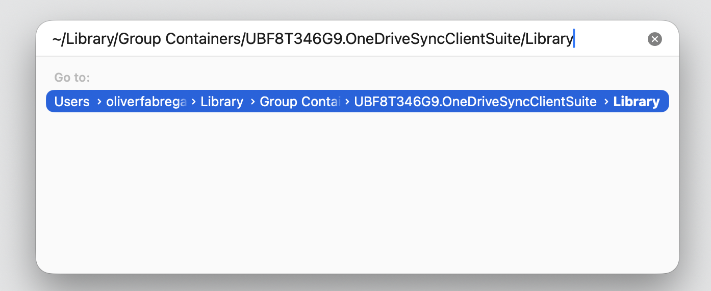 Finder Go to Folder path field on macOS with the OneDriveSyncClientSuite Library path typed to delete the OneDrive cache.