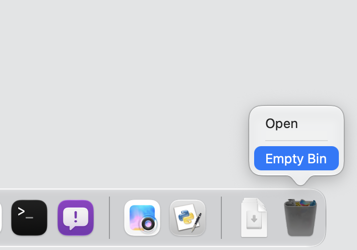 The Bin on a MacBook being emptied with a Control-click to clear leftover app cache when an app is not opening on your Mac.