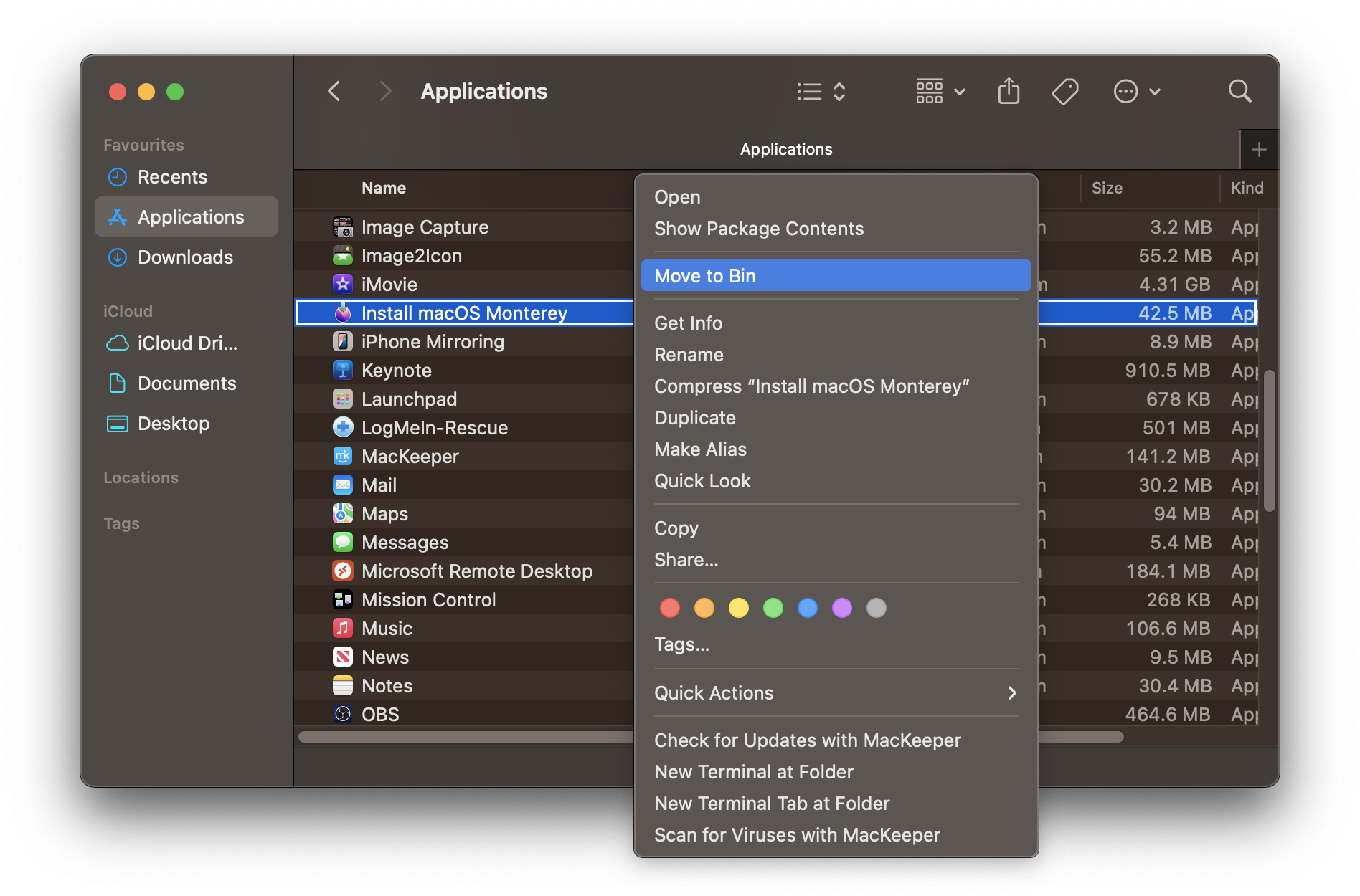 A Finder window showing the Applications folder with a right click context menu open on the Install macOS Monterey file. The option Move to Bin is highlighted in blue at the top of the menu.
