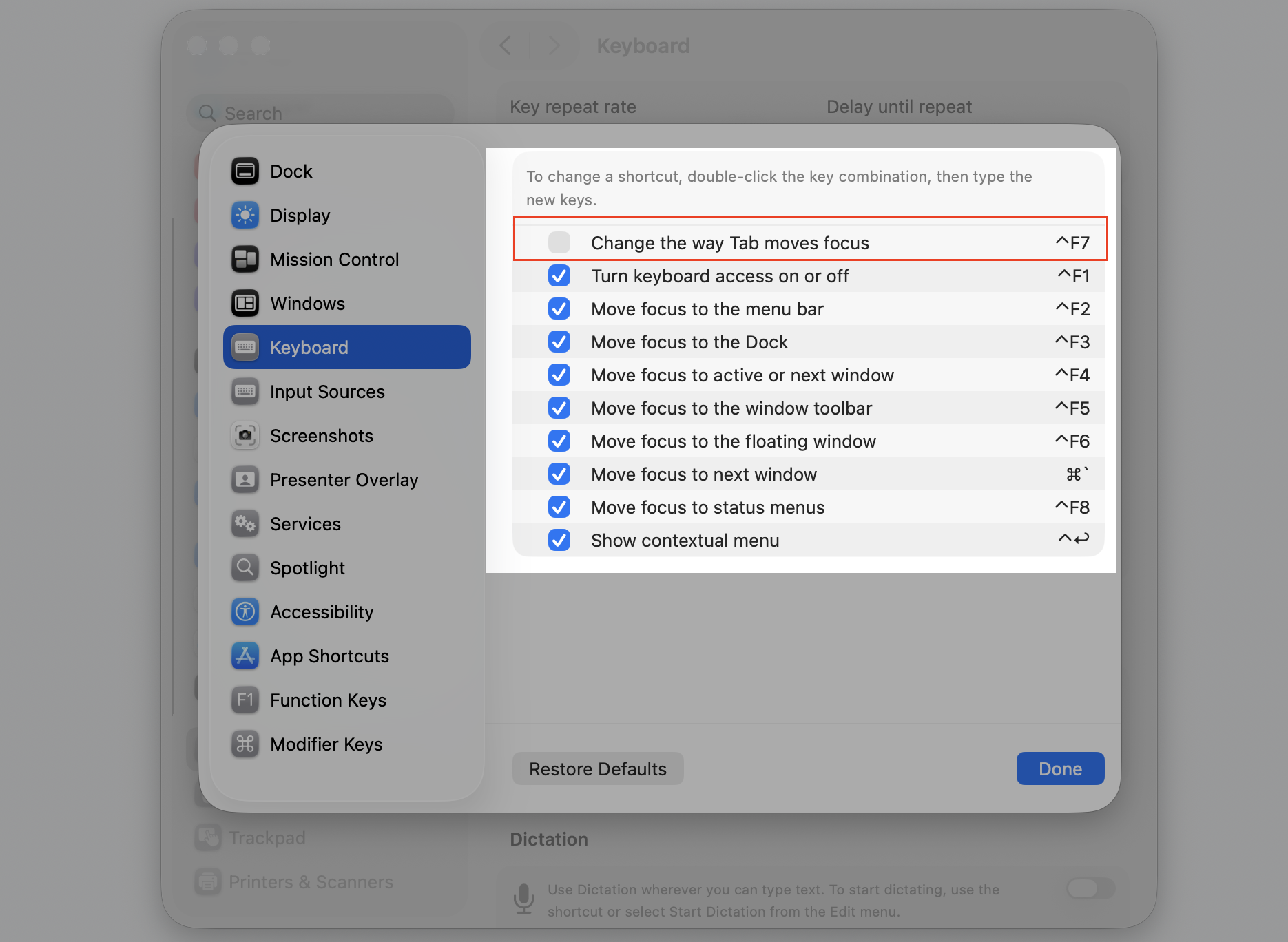 The macOS Keyboard Shortcuts panel on an Apple computer, selecting a grayed-out shortcut checkbox to re-enable a disabled MacBook hotkey.