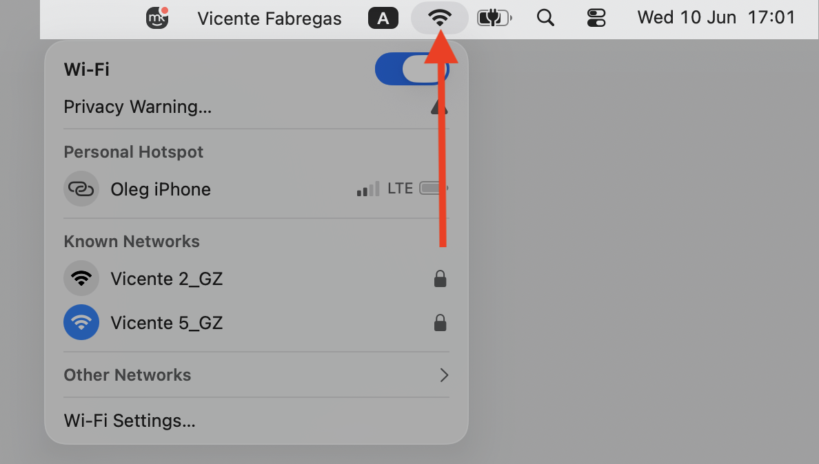 macOS menu bar on a MacBook with Network Settings selected from the top-right corner to switch Wi-Fi and rule out connection issues.