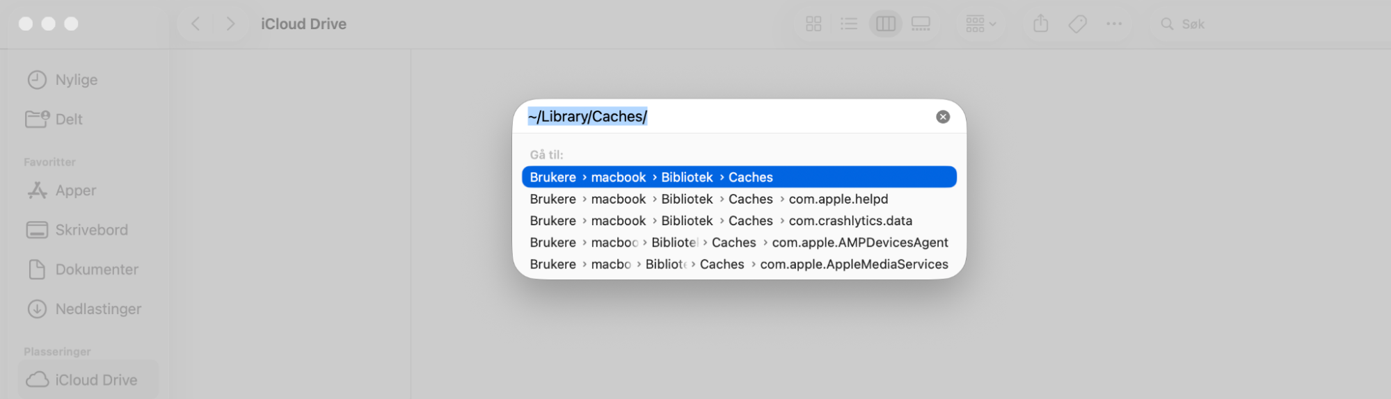 Skriv inn ~/Library/Caches i tekstboksen, og klikk på Gå. Dette tar deg til mappen Caches, der du kan tømme hurtigbuffer på Macen din.