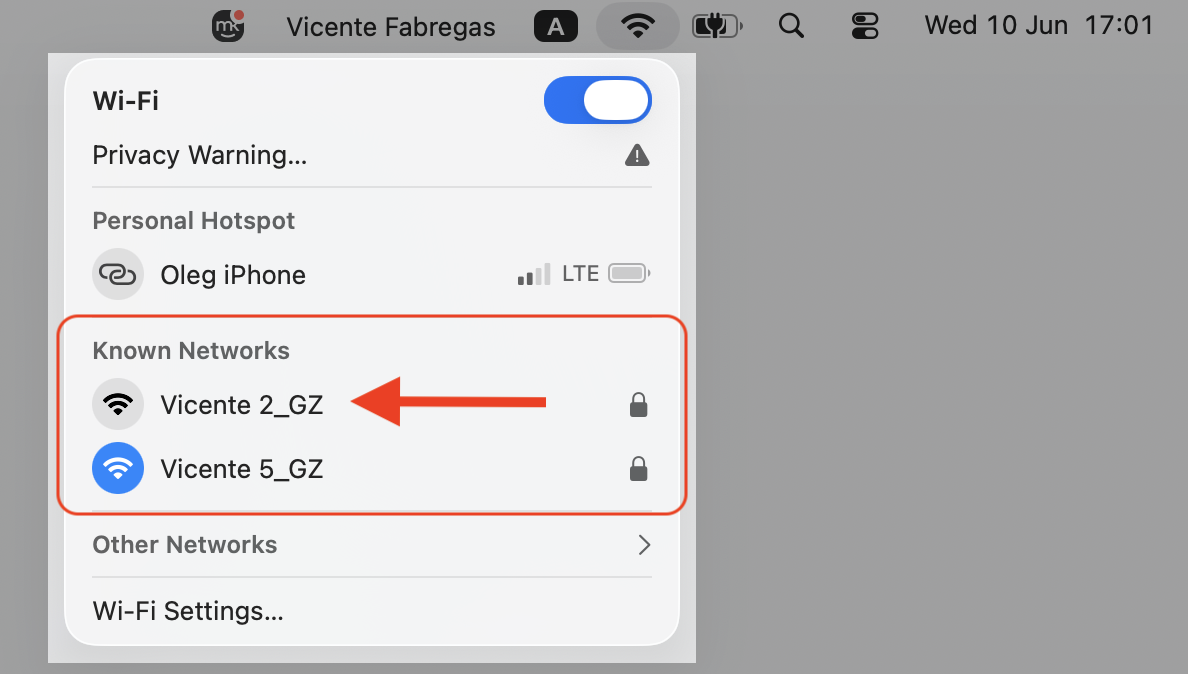 macOS Network Settings on an Apple computer showing available Wi-Fi networks where you switch connections to test identityservicesd CPU load.