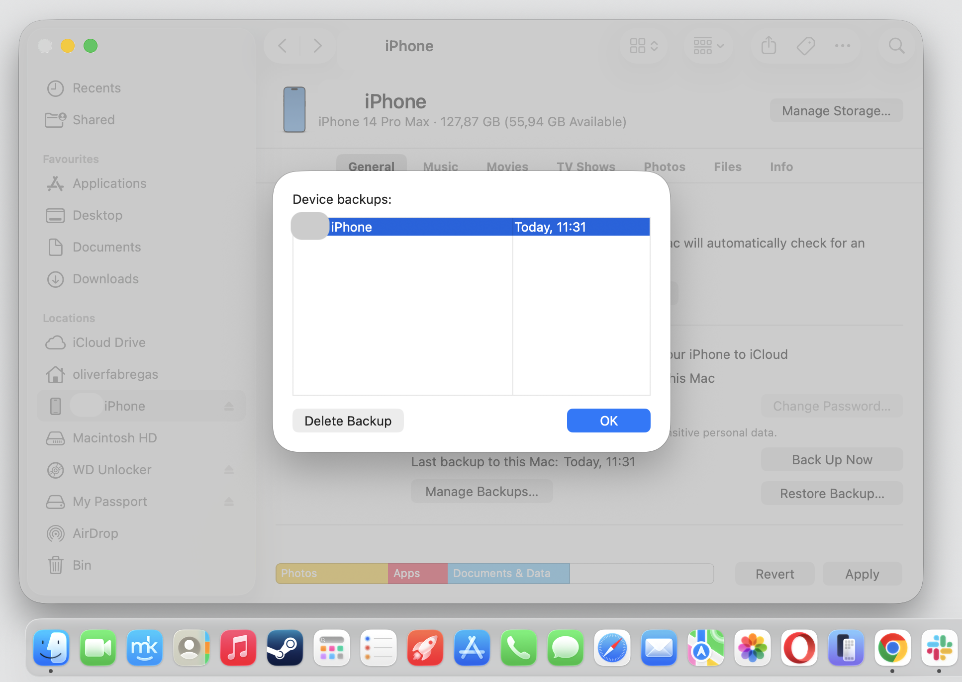 Device backups dialog in Finder on macOS with an iPhone backup selected and Delete Backup ready to free storage on this Apple computer.