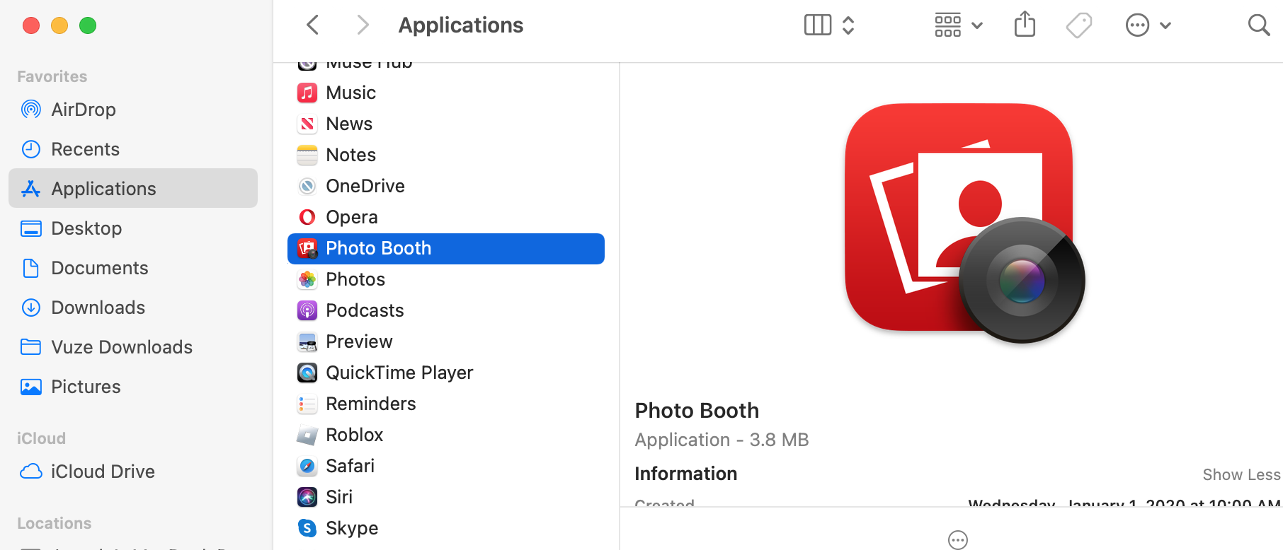 The Applications folder appears on a Mac. Find and open the Photo Booth app to take a picture with a Mac camera on your computer.