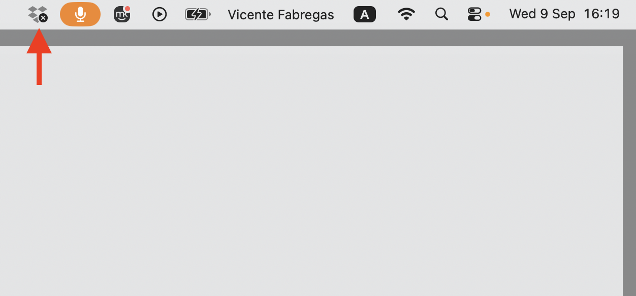 The macOS menu bar with the Dropbox icon back in view after updating the app, confirming the fix worked on the Apple laptop.