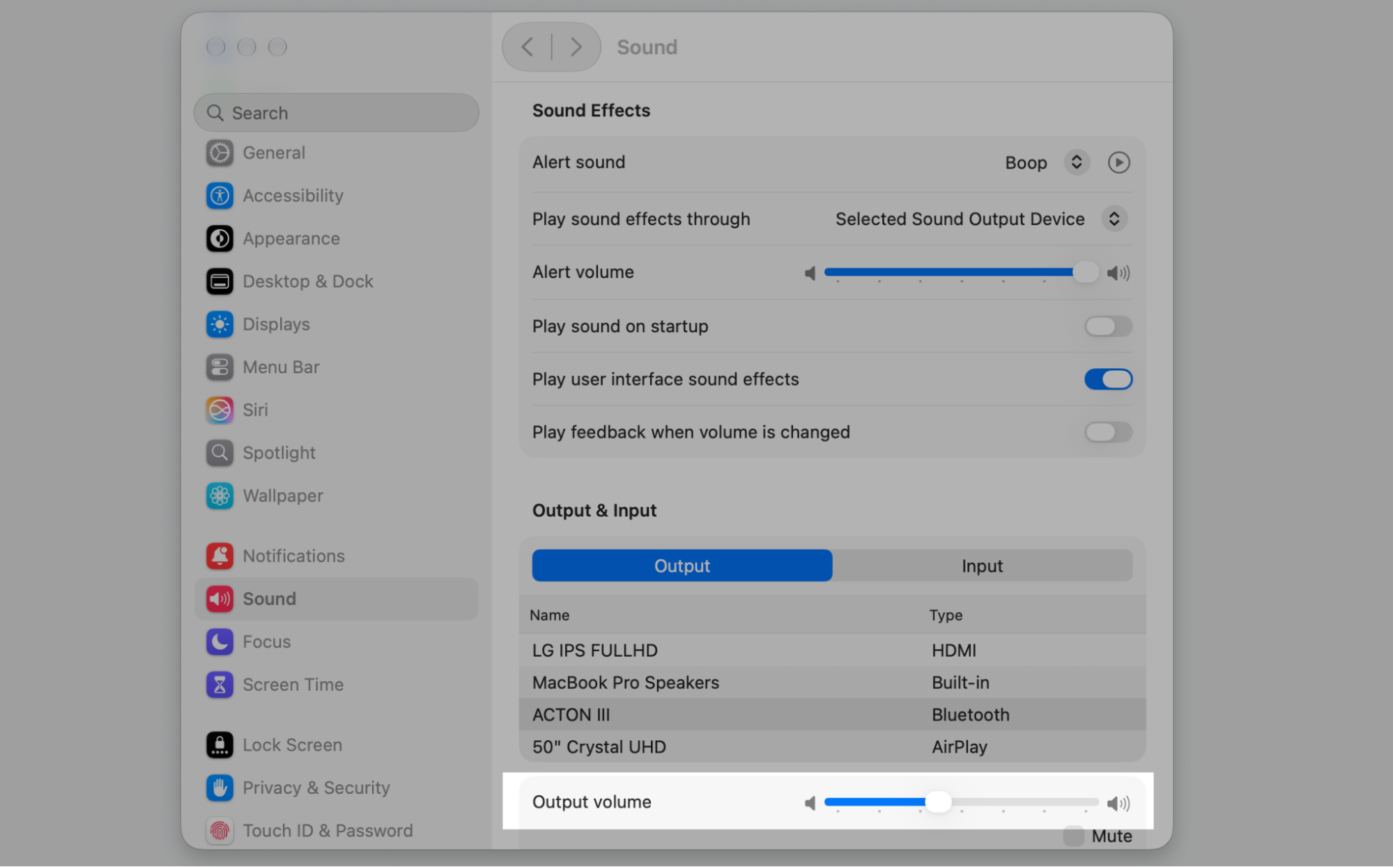 The Sound pane in macOS System Settings highlighting the Output volume slider at the bottom to raise or lower sound on your MacBook.