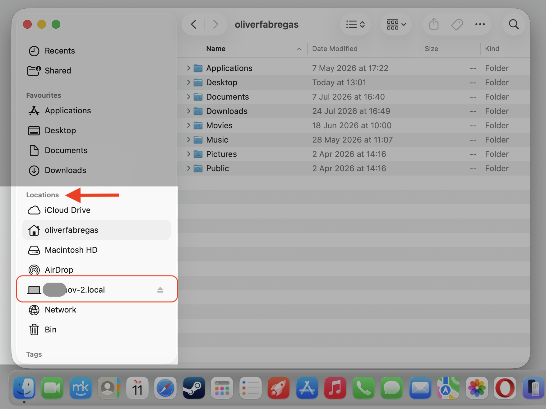 A Finder window on macOS showing the connected Mac under Locations, where you open its shared folders after connecting from your MacBook.