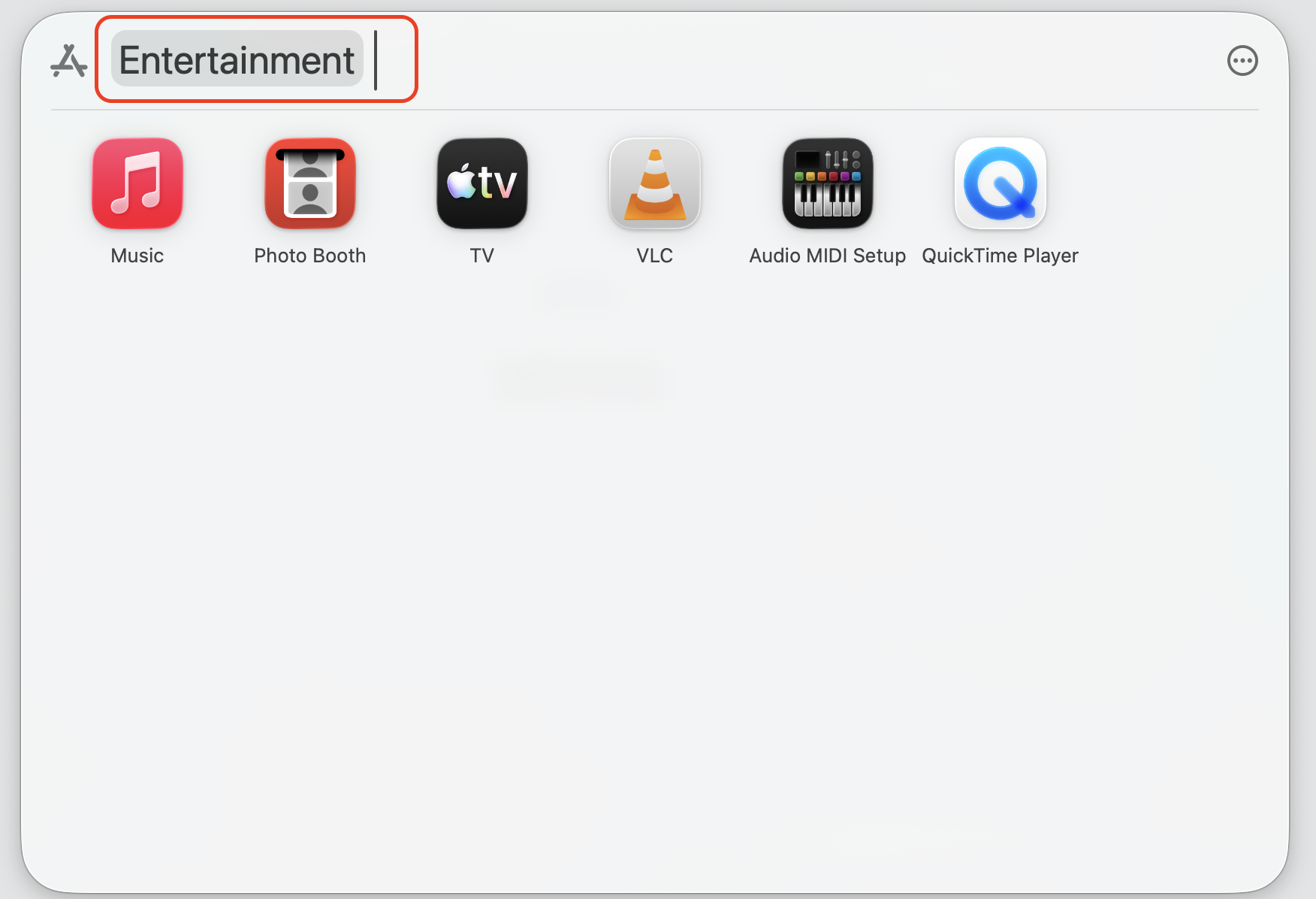 The Spotlight Applications view on macOS Tahoe filtered to the Entertainment category to find apps fast on an Apple computer.