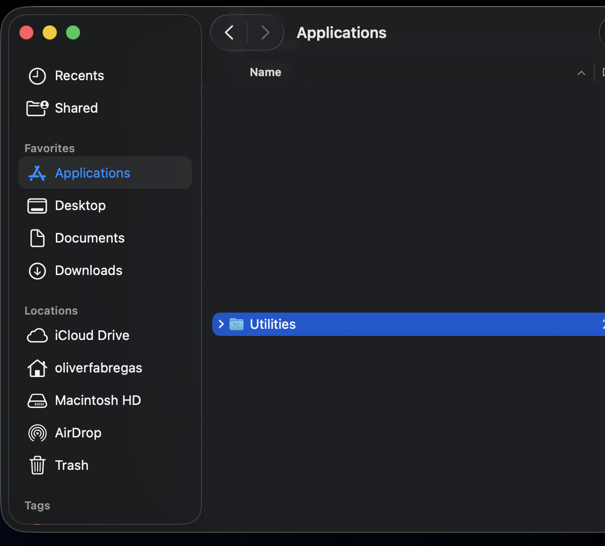 Navigating Finder to Applications then Utilities on an iMac is the first step to open Terminal for disabling Gatekeeper on macOS.