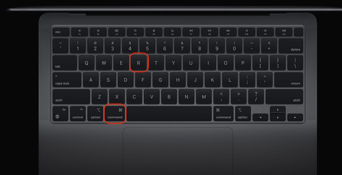 A mockup of a Mac keyboard. Press and hold the Command + R keys and release them when the Apple logo appears to use Disk Utility in Recovery Mode.