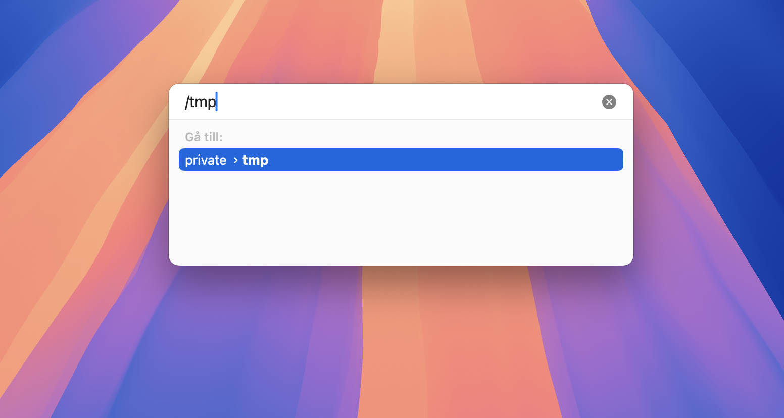 Finder på Mac som visar funktionen Gå till mapp. För att ta bort tillfälliga Photoshop-filer, skriv först /tmp och tryck sedan på Retur för att gå till den tillfälliga mappen.