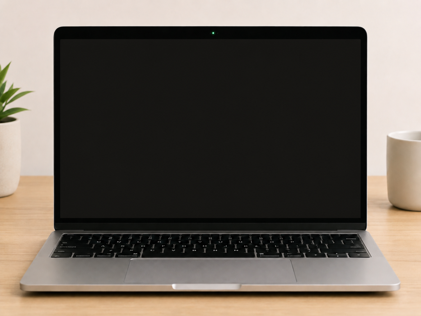 MacBook camera area above the display after quitting apps, showing the green light on the Apple laptop switched off once nothing uses it.