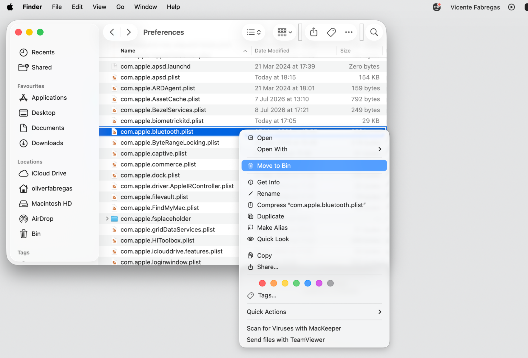 macOS Bluetooth Control Center panel on a MacBook used to reset Bluetooth by clearing preference files and restarting the bluetoothd service.
