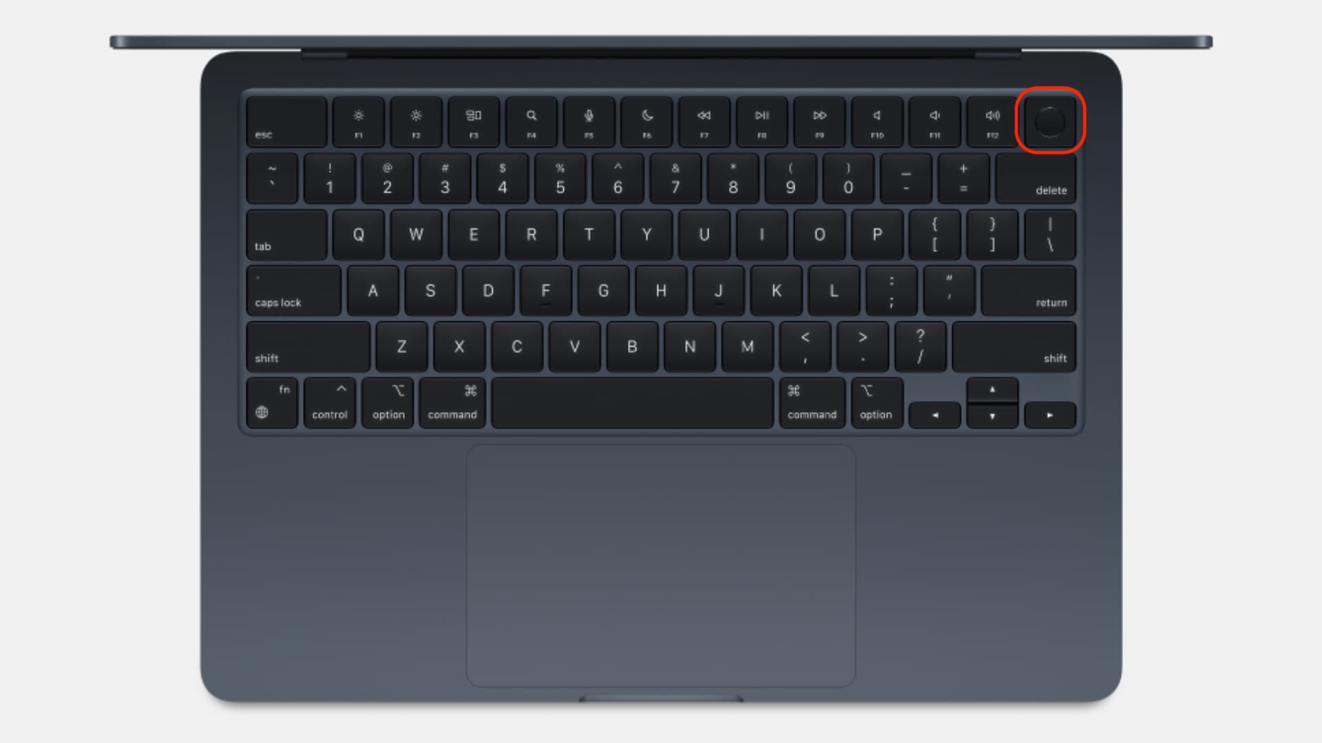 Top-down MacBook view with the power button highlighted, which you press and hold to reach macOS Recovery Mode on an Apple Silicon Mac.