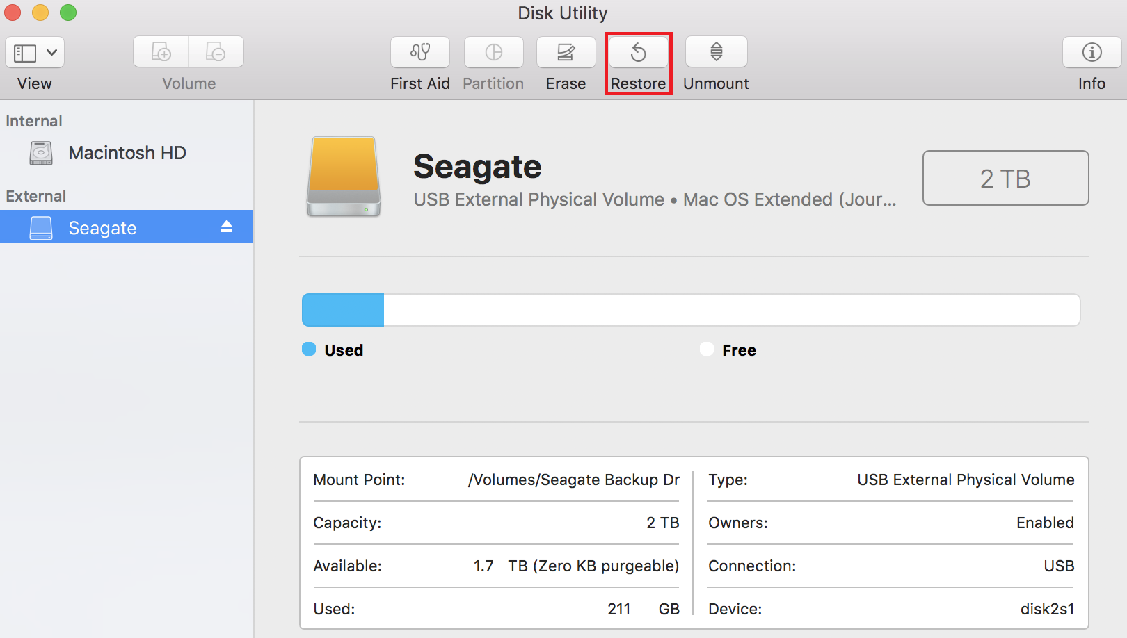 Disk Utility on Mac shows all drive options. Click Restore to restore data from a cloned drive.