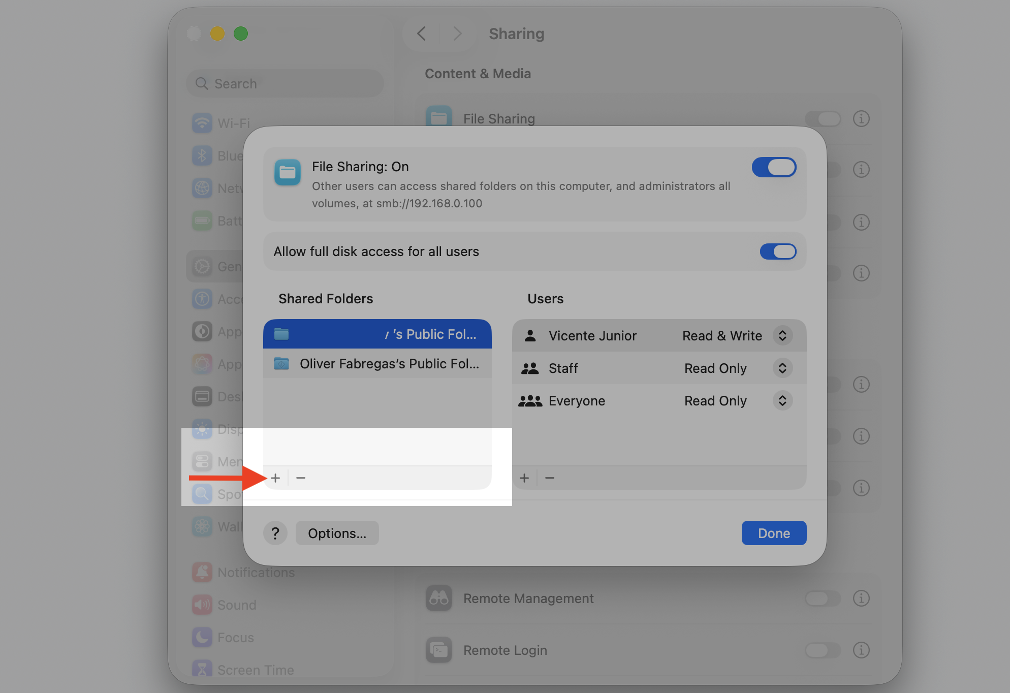 The File Sharing options sheet on a Mac, where you click the add (+) button under Shared Folders to pick a folder and share it.