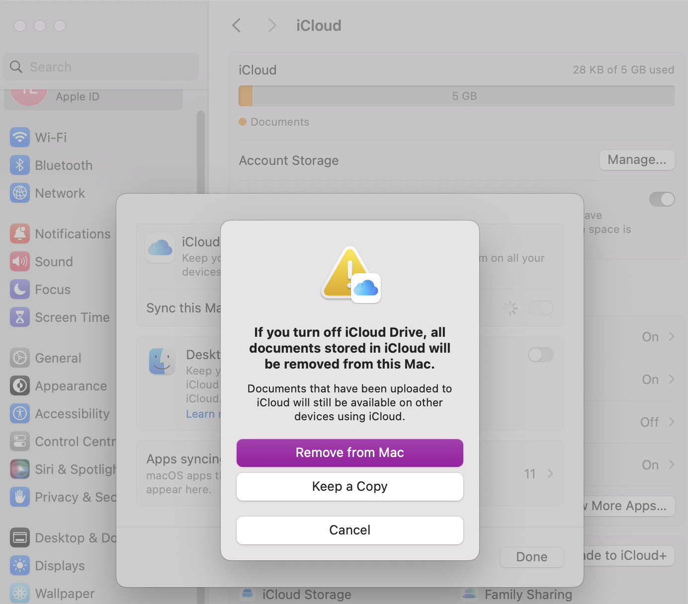 To pause the syncing of iCloud on your Mac, you need to open your Settings, click on Apple ID and look for iCloud Drive. From there, press where it says On and deselect the Sync this Mac to pause processes.